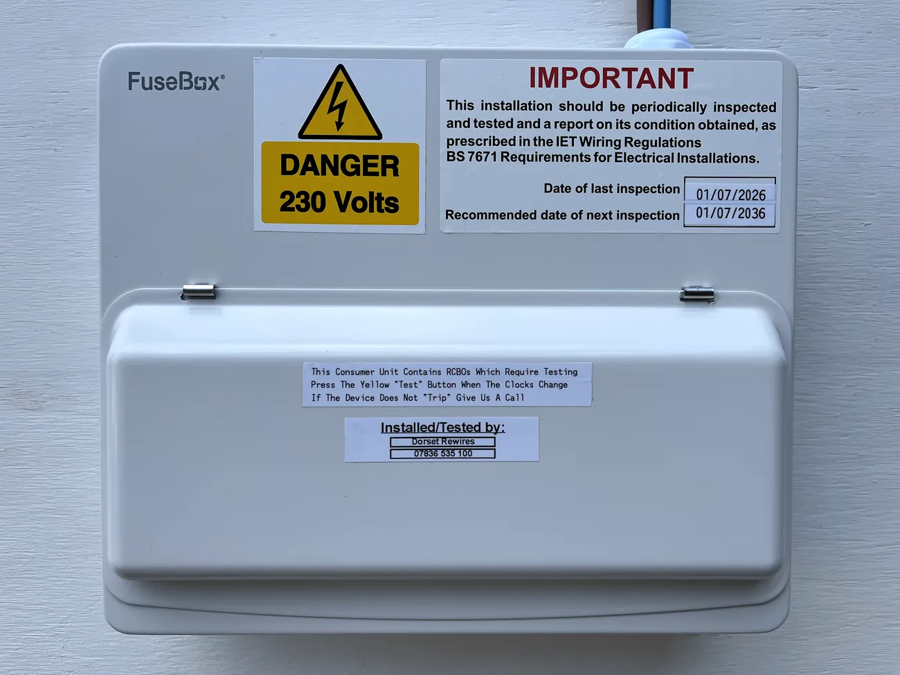 Finished consumer unit with the cover on, tested and labelled by Dorset Rewires with the inspection dates recorded